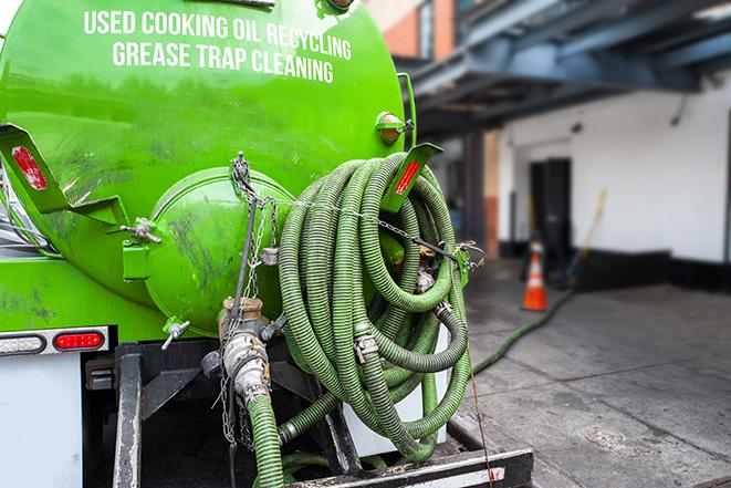 a service truck pumping grease from a restaurant's grease trap in Cleveland, MO